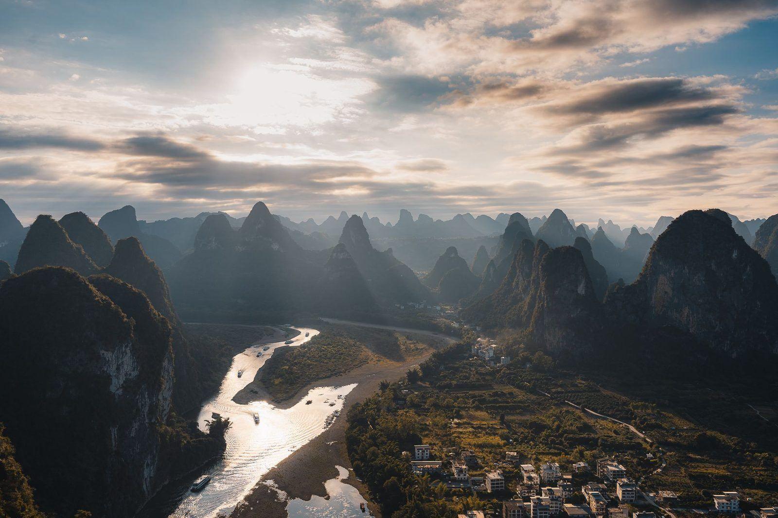 The Li River winding through misty karst peaks near Guilin at dawn